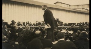 Booker-T.-Washington-speaking-on-a-stage-in-Mound-Bayou-Mississippi_LC-DIG-ppmsca-13306_Library-of-Congress