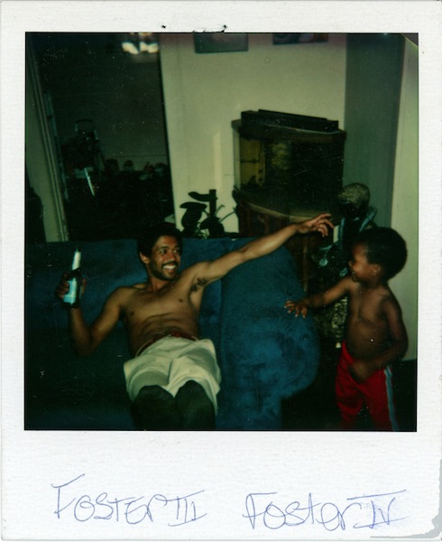 A young father enjoying some downtime at home with his son. The caption reads "Foster III Foster IV". Date Unknown.